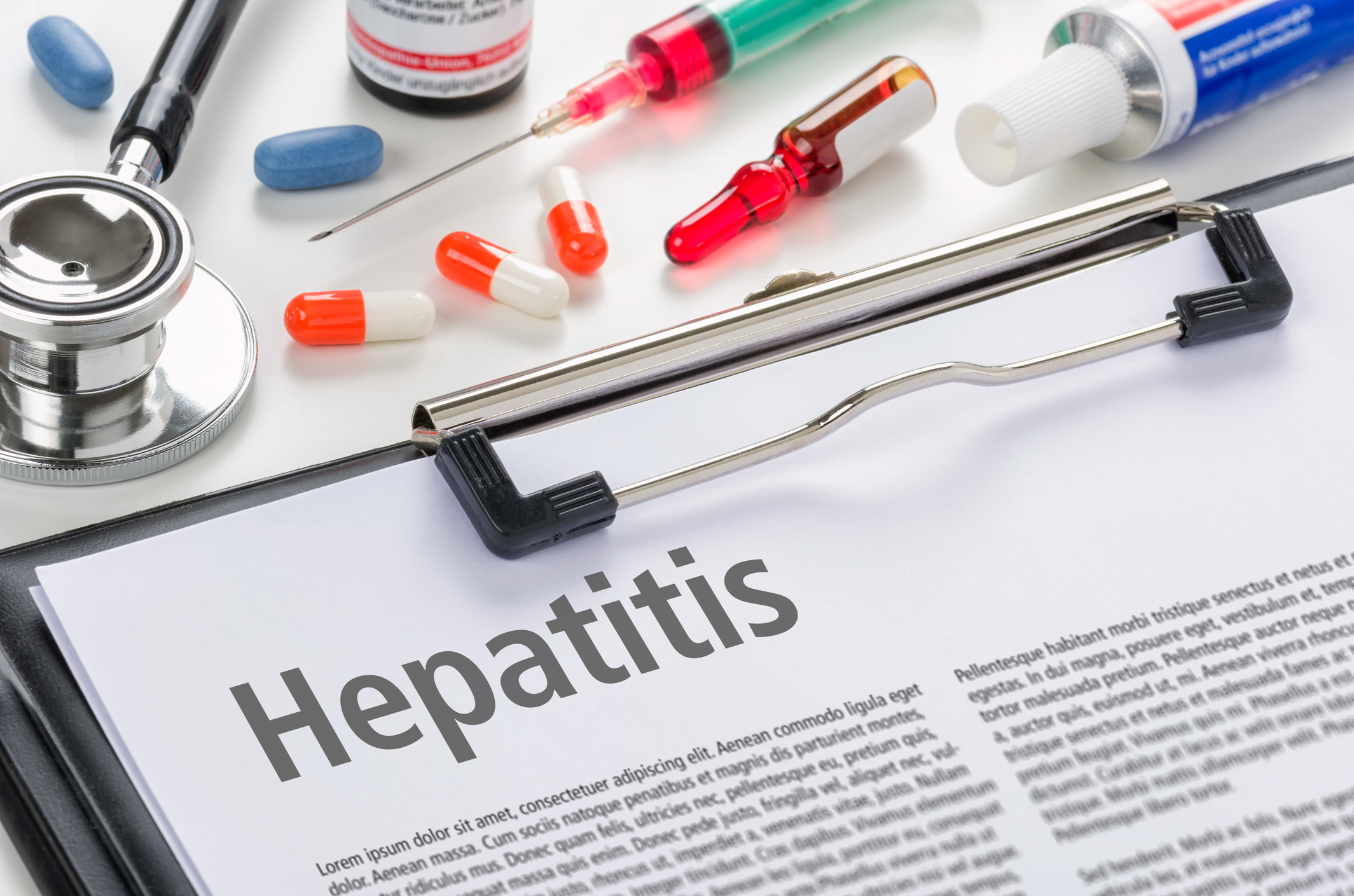 The diagnosis Hepatitis written on a clipboard
